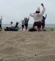 Man Takes a Nap During Sunday Morning Beach Yoga