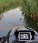 Jet Skiing Through a Marsh at Sunset