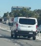 Girl Spotted Kicking at Van on Freeway