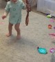 Little Girl Plays With a Big Snake
