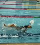 Woman Gives Backstroke Her All