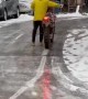 Motorcycle Slides Up Slippery Road
