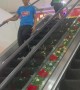 Woman Distracted By Receipt Doesn't Move On Broken Escalator