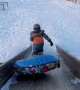Kid Stumbles Off The Sledding Ramp
