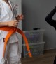 Young Karate Practitioner Kicks Mother's Head