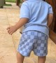 Kid Runs Into Trash Can and Falls Over