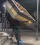 Man Carries a Bed While Riding a Bicycle