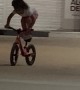 BMX Girl Stands On Bicycle Seat