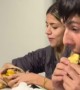 Small Girl Takes Bite of a Triple Burger