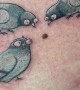 Tattoo of Silly Pigeons Pecking at a Mole