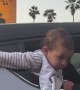Baby Spotted Leaning Out of Car Window