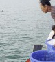Fisherman Casually Fills Ice By Tossing Buckets
