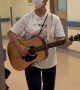 Elderly Woman Sings for Patients and Staff at a Hospital