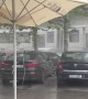 Stormy Winds Push Umbrella Into Car