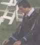 Dystopian Outdoor Graduation in Heavy Downpour