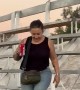Woman Loses Balance and Takes a Slow Fall