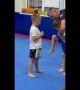 Two Boys Learning How to Properly Kick