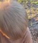 Toddler Holding a Lizard